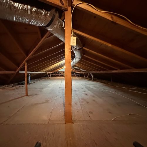 Completed junk removal of a cluttered attic by TR and Sons for a happy WW2 vet